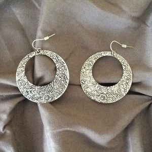 Silver tone hanging floral embossed earrings